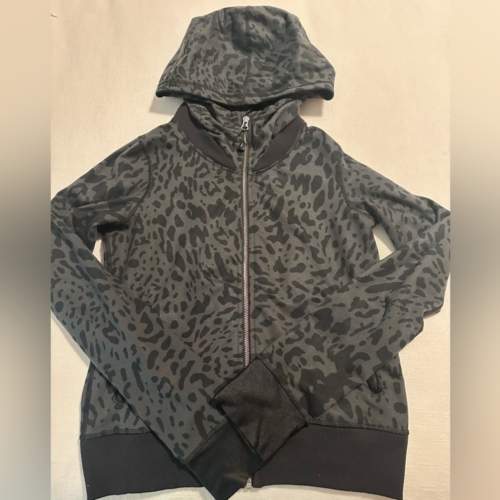 Lululemon Zip Up hoodie. Grey and black leopard print with pleating in the back.